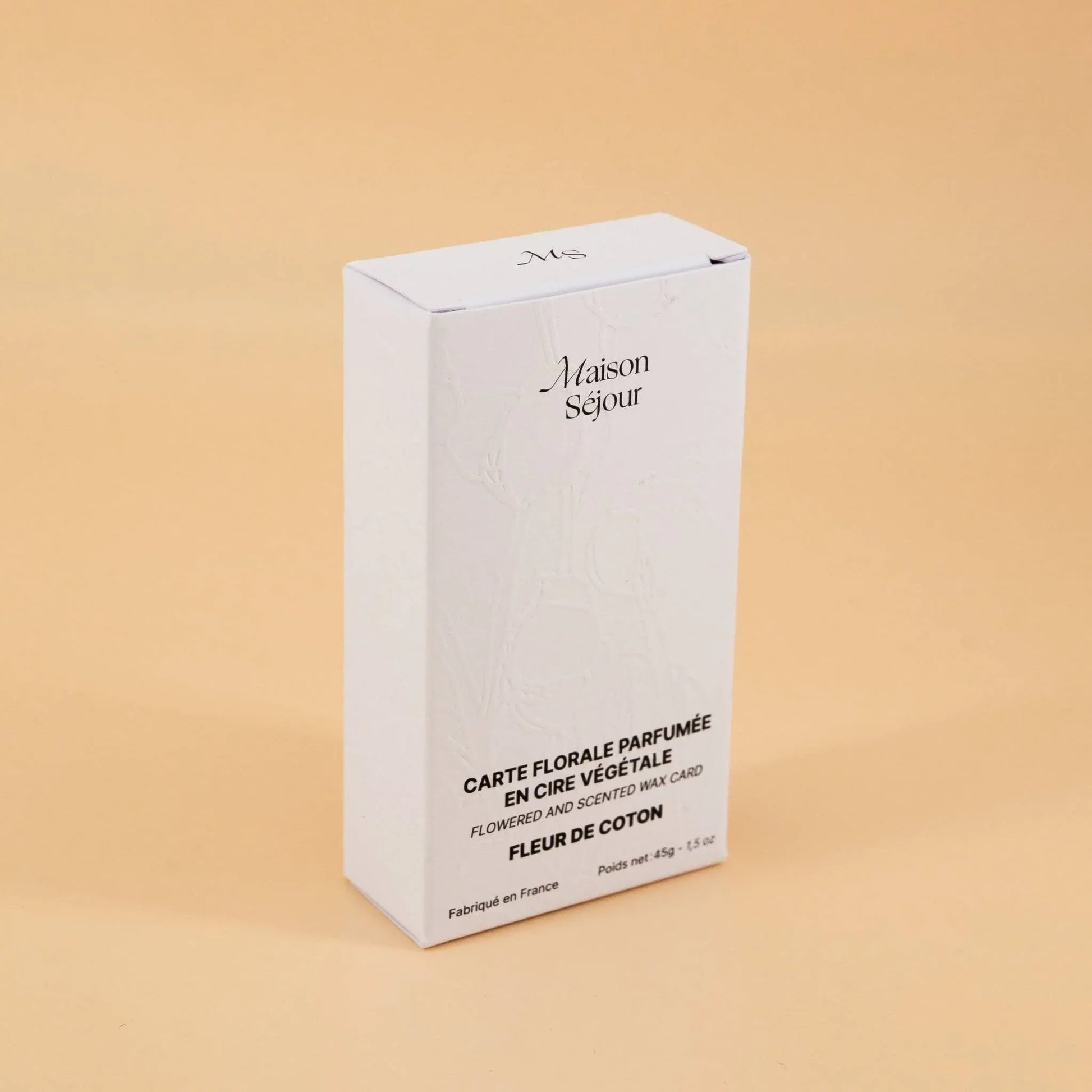Boîte blanche, packaging d'une carte florale parfumée.