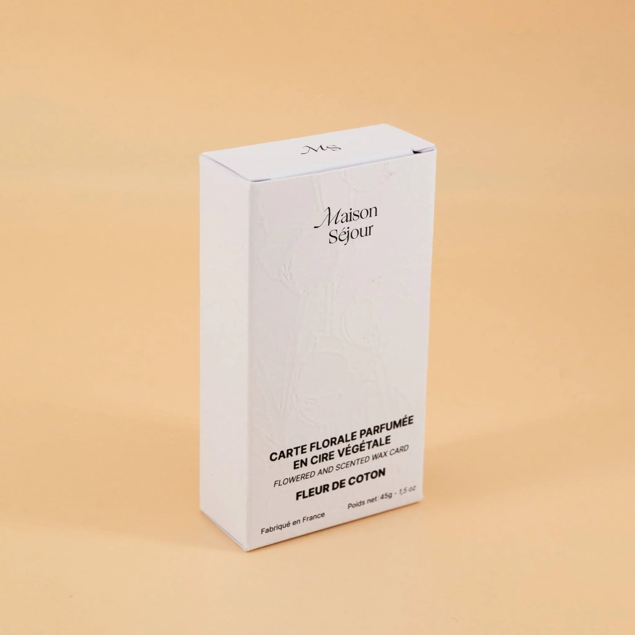 Boîte blanche, packaging d'une carte florale parfumée.